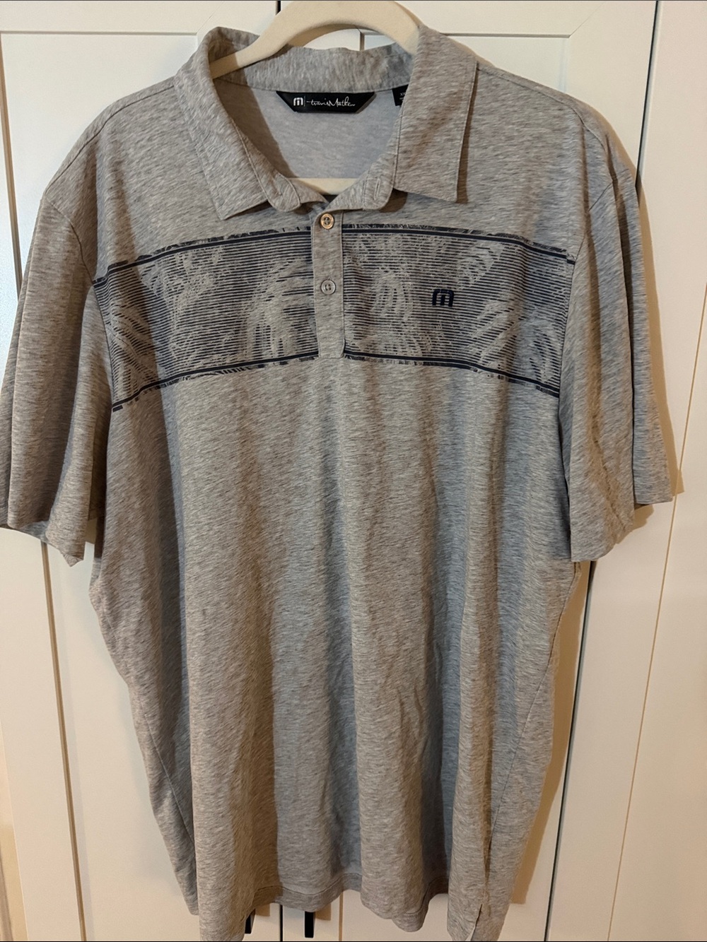 Travis Mathew Light Gray Polo with Navy Chest Stripe
